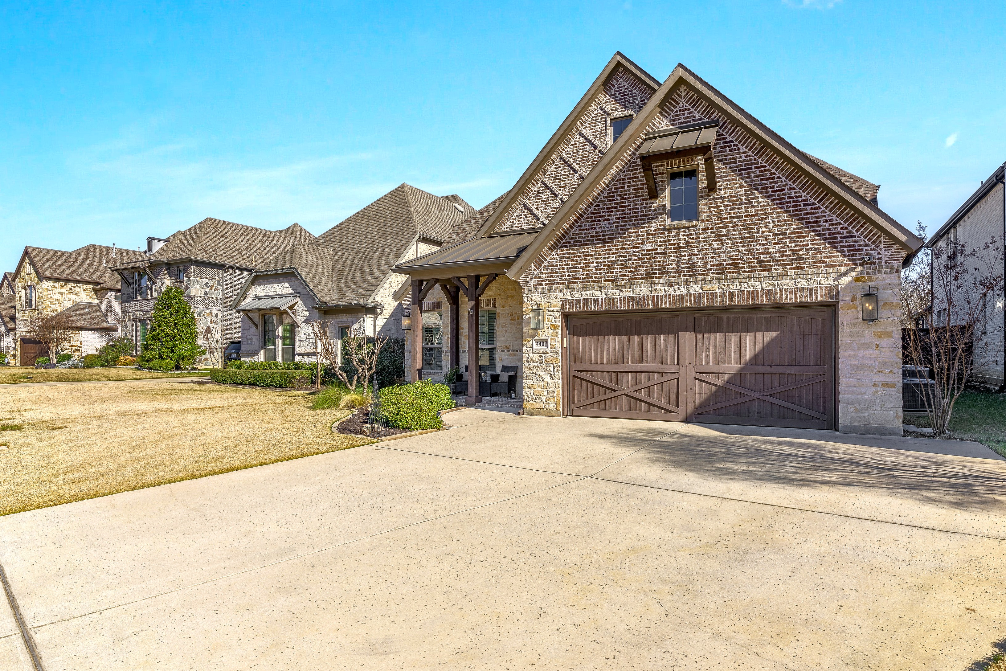 Front exterior showcasing architectural details and landscaping