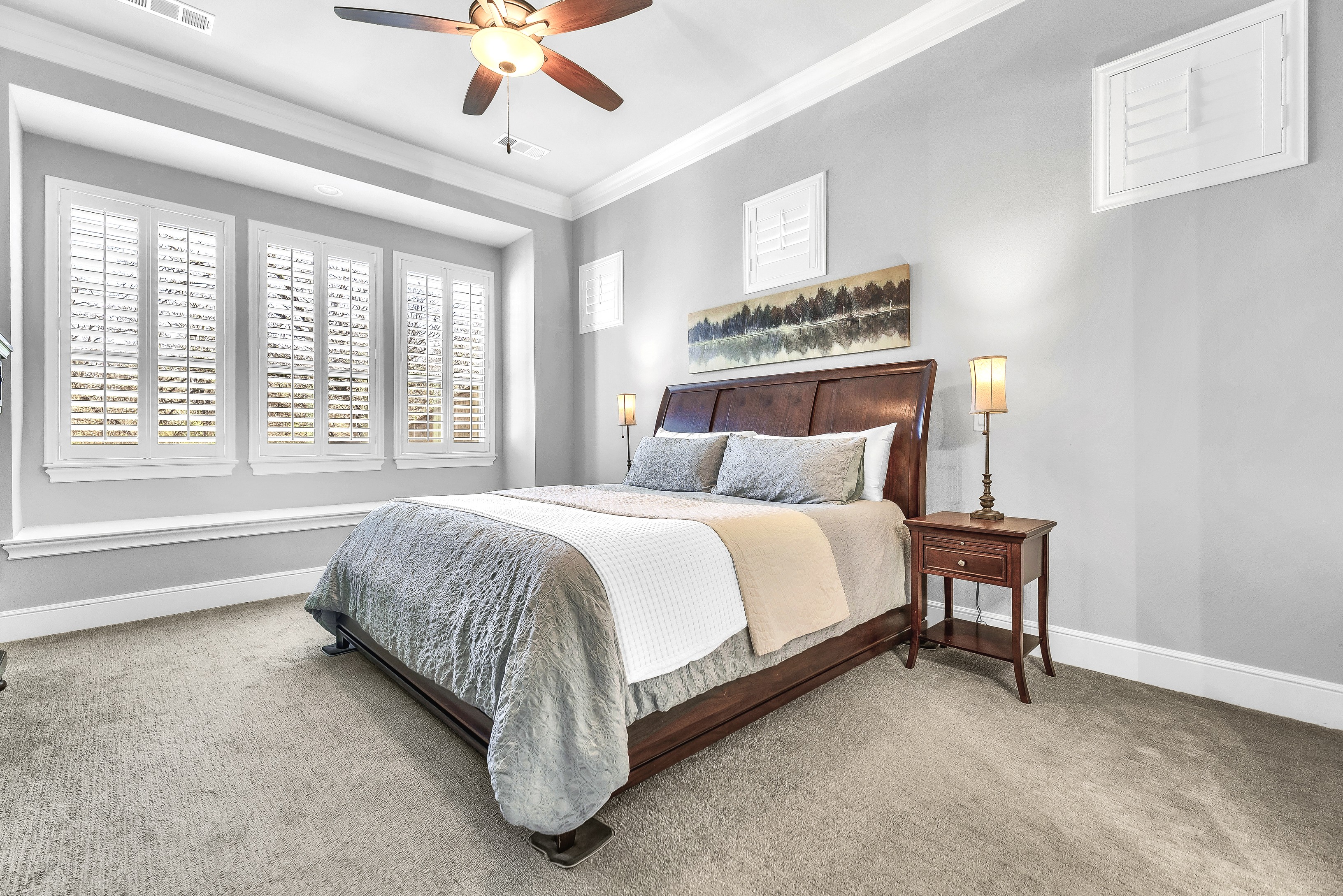 Primary suite with sitting area and natural light